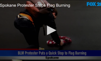 Spokane Protester Stops Flag Burning