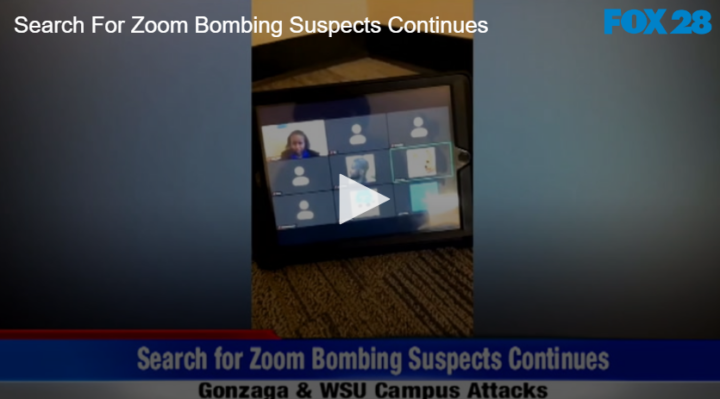 black tablet on the ground connected to a zoom meeting