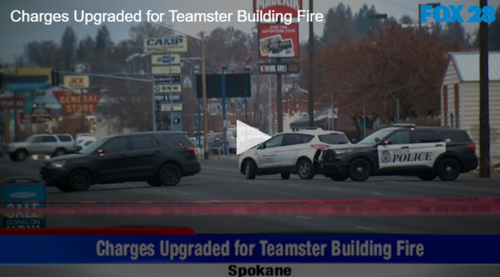 street with three cars one a police car