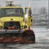 Snow plows are back on the road as snow falls in Spokane