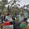 Lewis County deputies save three people in a trailer from a fallen tree