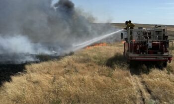 Adams County brush fire damages structures, prompts evacuations
