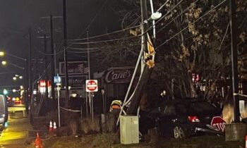 Raising Cane’s loses power after overnight crash between car, powerline