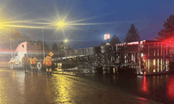 Roundabout at WB I-90 on-ramp closed due to overturned semi truck