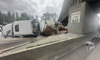 Driver hospitalized, diesel fuel spills in semi rollover on I-90 near Spokane
