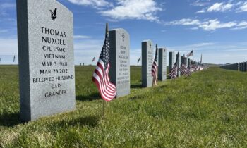 Volunteers place thousands of flags at veterans cemetery for Memorial Day